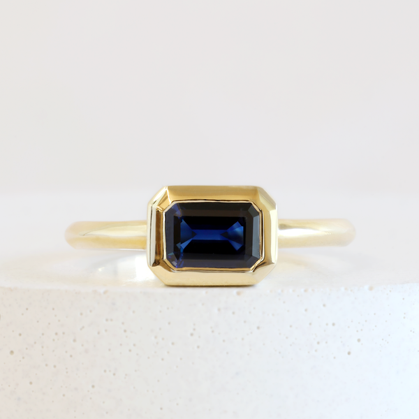 Ethical Jewellery & Engagement Rings Toronto - 1.21 ct Deep Water Blue Customized Rectangular Wren Bezel Ring in Yellow Gold - FTJCo Fine Jewellery & Goldsmiths