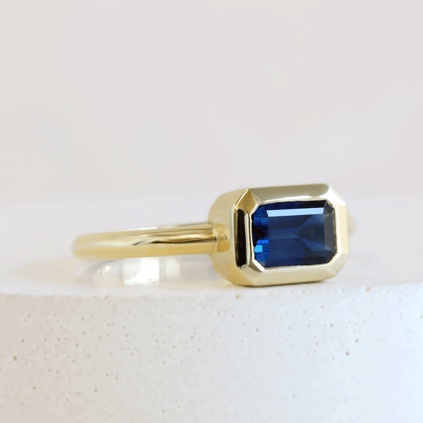 Ethical Jewellery & Engagement Rings Toronto - 1.21 ct Deep Water Blue Customized Rectangular Wren Bezel Ring in Yellow Gold - FTJCo Fine Jewellery & Goldsmiths