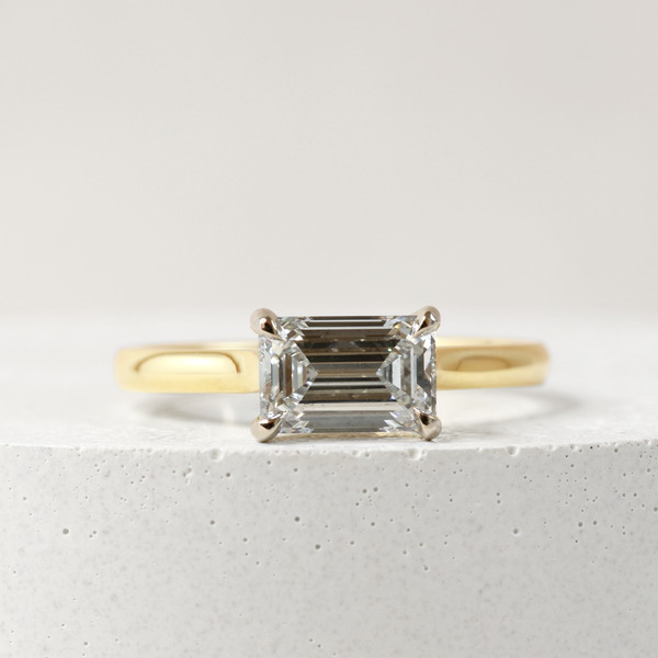 1.09 ct Horizontal Emerald-cut Bi-Colour Love Note with Partial Hidden Halo in Yellow and White Gold