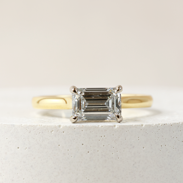 1.09 ct Horizontal Emerald-cut Bi-Colour Love Note with Partial Hidden Halo in Yellow and White Gold