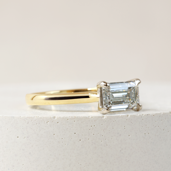 1.09 ct Horizontal Emerald-cut Bi-Colour Love Note with Partial Hidden Halo in Yellow and White Gold
