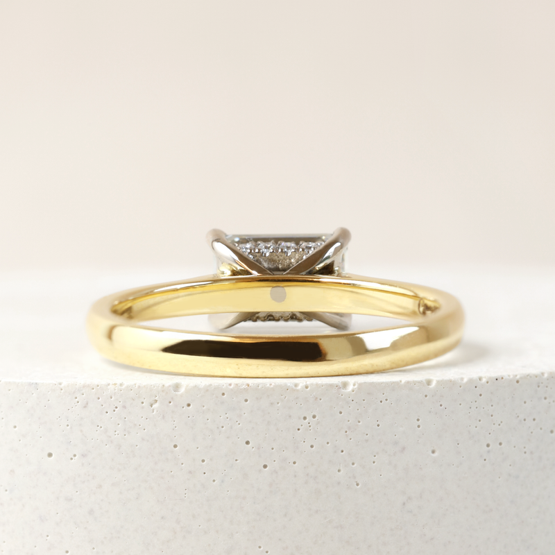 1.09 ct Horizontal Emerald-cut Bi-Colour Love Note with Partial Hidden Halo in Yellow and White Gold