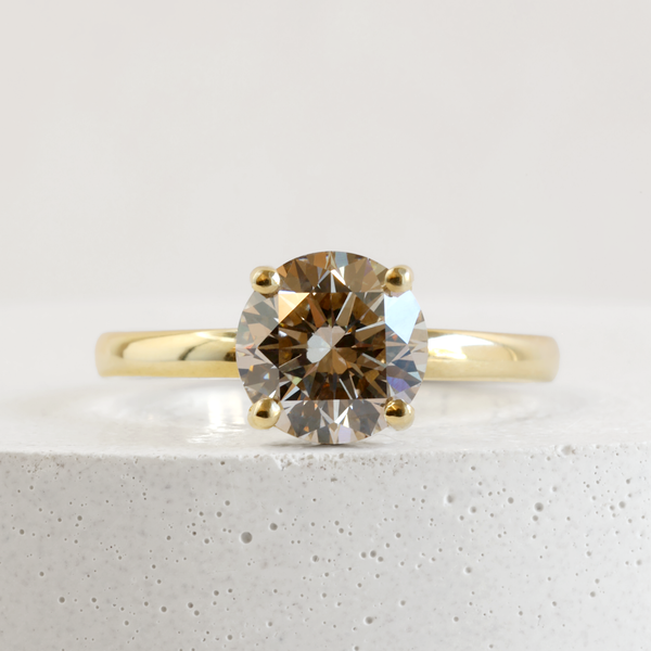 1.51 ct Warm Grey Pietra Round Solitaire in Yellow Gold
