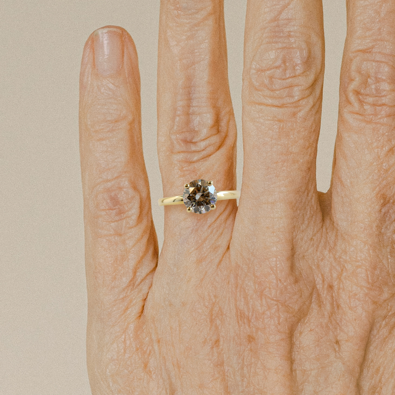 1.51 ct Warm Grey Pietra Round Solitaire in Yellow Gold