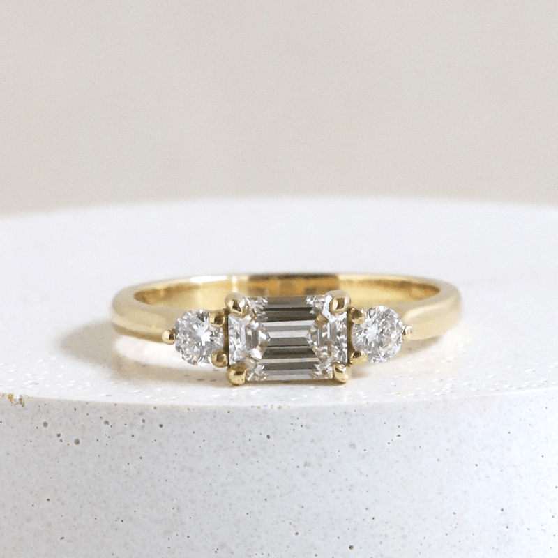 Ethical Jewellery & Engagement Rings Toronto - 0.70 ct Emerald Cut Emilia with Round Accents in Yellow Gold - FTJCo Fine Jewellery & Goldsmiths