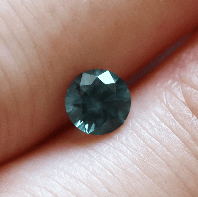 Ethical Jewellery & Engagement Rings Toronto - 0.78 ct Dark Teal Blue Round Brilliant Montana Sapphire - Fairtrade Jewellery Co.